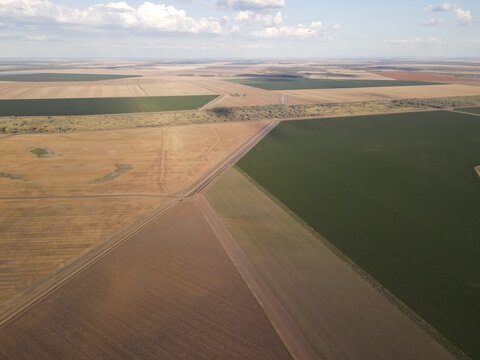 Aerial view of the Telleraga Bore site surrounded by diverse agricultural fields, including green crops and harvested land, in Mallowa, New South Wales, Australia.