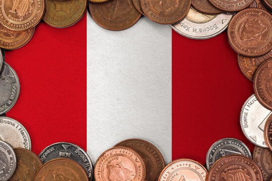Coins on flag of Peru trading investment business currency concept
