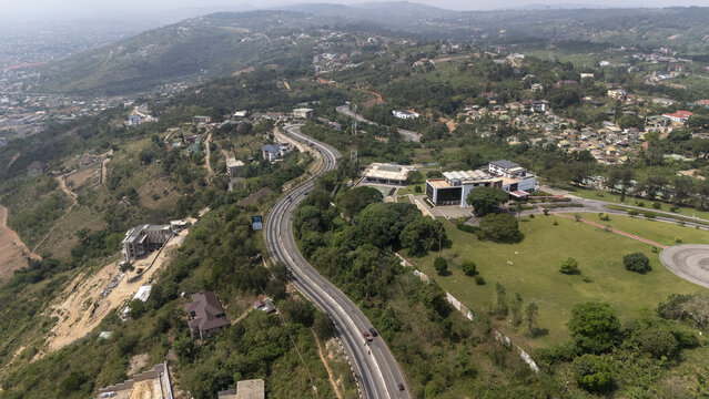 Aerial view of the Aburi hills and the winding road leading through the lush landscape in Aburi, Eastern Region, Ghana.