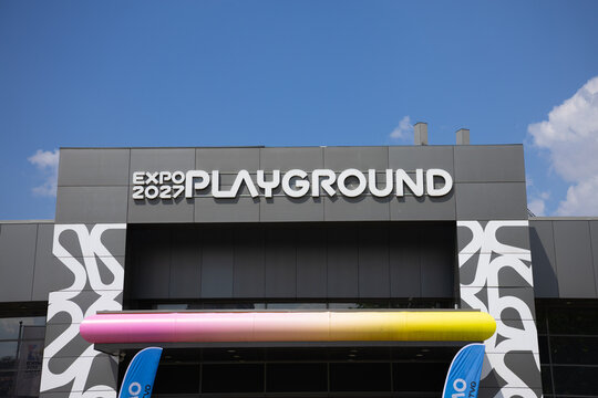 17 April 2026, Belgrade, Serbia: Expo 2027 playground signage on modern pavilion facade in Belgrade Serbia under blue sky. International exhibition branding