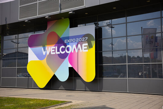 17 April 2026, Belgrade, Serbia: Expo 2027 welcome signage on glass pavilion facade in Belgrade Serbia with colorful gradient branding. International exhibition identity