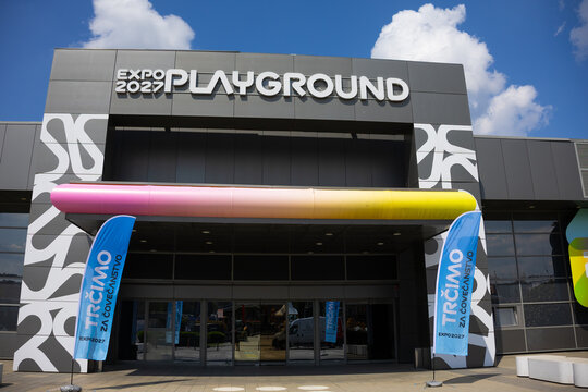 17 April 2026, Belgrade, Serbia: Expo 2027 playground signage on modern pavilion facade in Belgrade Serbia under blue sky. International exhibition branding