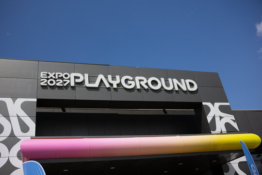 17 April 2026, Belgrade, Serbia: Expo 2027 playground signage on modern pavilion facade in Belgrade Serbia under blue sky. International exhibition branding