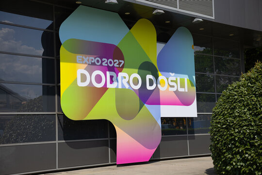 17 April 2026, Belgrade, Serbia: Expo 2027 welcome signage on glass pavilion facade in Belgrade Serbia with colorful gradient branding. International exhibition identity