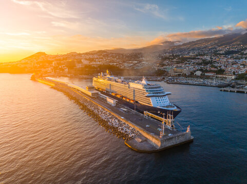 Aerial view of a large cruise ship docked at the pier in Funchal, Madeira, Portugal.