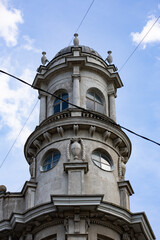 Ornate domed turret of historic building against blue sky © Mariia