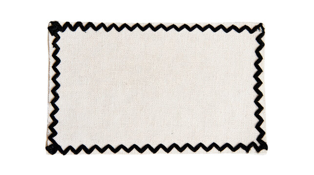Blank white fabric patch with black zigzag stitched border on a white background
