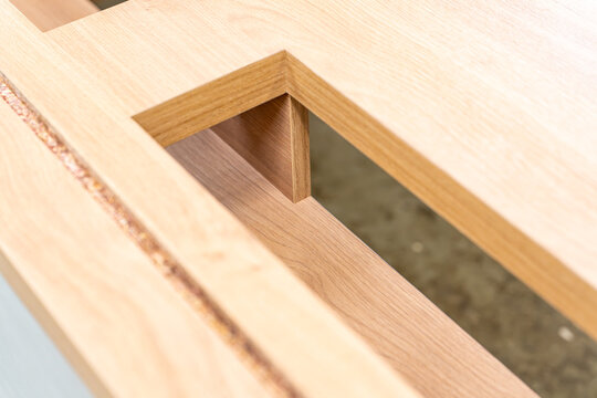Corner joint detail of an oak desk