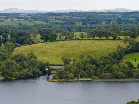Aerial view of the lush green landscape and rolling hills surrounding the lake in Leitrim, County Leitrim, Ireland.