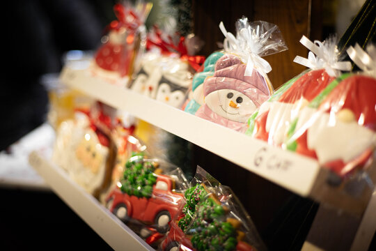 Traditional holiday cookies and jack frost biscuits wrapped on sale at the Christmas market on a stand. Close-up with no people.