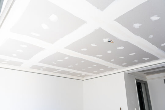 Plasterboard ceiling with taped joints under renovation