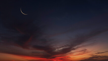 Night sky, Crescent moon on dusk sky twilight after sundown, Religion of Islamic well space for text Eid Al Adha, Eid Al Fitr, Eid Mubarak, Muharram © Nature Peaceful 