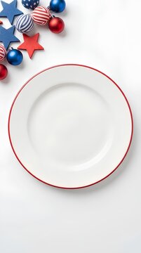 Empty white plate on white background with patriotic star and ball decorations.