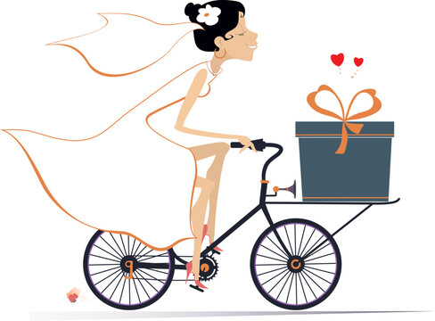 Pretty bride in the white dress and wedding veil riding conveys a big gift box on the bicycle