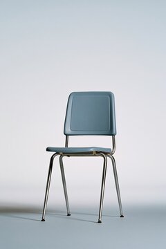 Blue plastic chair with a sleek metal frame standing against a neutral background, featuring a smooth matte finish for interior design mockups