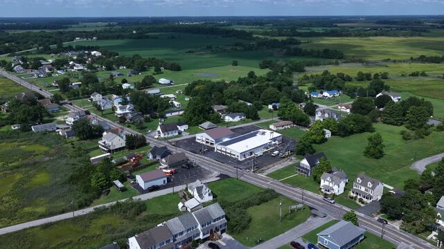 Residential homes surrounded by green farmland landscape living at Bowers Beach by Delaware coastline