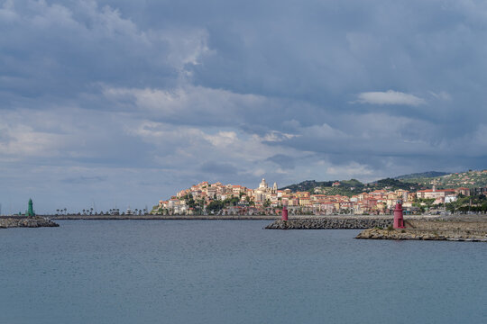 Clouds over coastal city. Imperia, Liguria Region, Italy