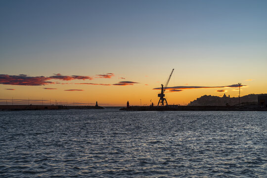 Sunset silhouette coastal city