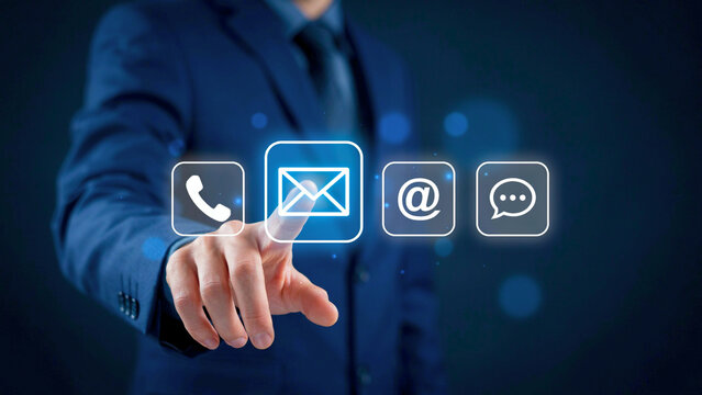 Businessman touching contact us digital icons for customer support and communication technology concept
