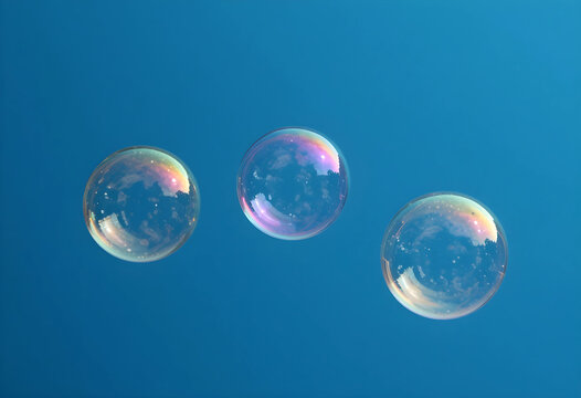Childhood joy and playful innocence, three iridescent soap bubbles floating freely against a clear blue sky background