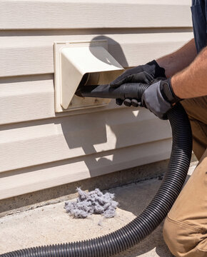 Vacuuming lint from an exterior dryer vent hood