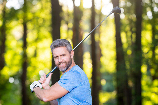 Golfer swing. Golfer powerful swing. Man in Golf club. Outdoor golf practice. Golfer completes backswing. Man practice Golf outdoors. Golf club concept.
