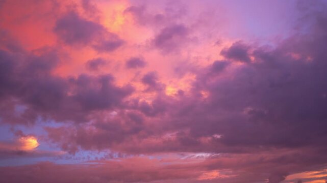 scenery pink cloud in purple sky of sunset above the ocean. 
purple clouds cover the ocean during colorful cloud in sunset at Kata beach Phuket.
video 4K. Scene of pink light in the sky background.