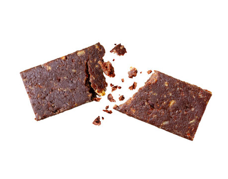 Chocolate energy bar broken into two halves in the air, close-up, isolated on transparent background