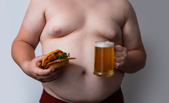 Beer belly shows overweight man. Beer belly shows obese man. Beer belly shows fat man. Beer belly shows body fat.
