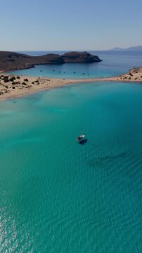 Discover the stunning beauty of Simos Beach on Elafonisos Island. The tranquil turquoise waters and golden sands create a perfect escape for relaxation and adventure under the Mediterranean sun.