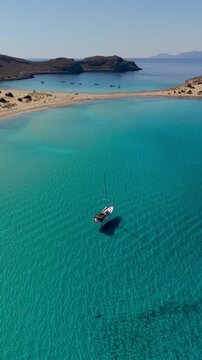 Experience the breathtaking beauty of Simos Beach on Elafonisos Island with its crystal-clear turquoise waters and stunning sandy shores. A perfect destination for relaxation and adventure.