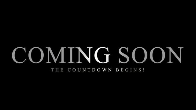 Coming soon text announcement with silver metallic typography on black background