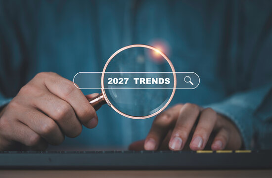 2027 trends search with magnifying glass representing future market research, business forecasting, emerging opportunities, consumer insights, strategic planning and trend analysis for growth.