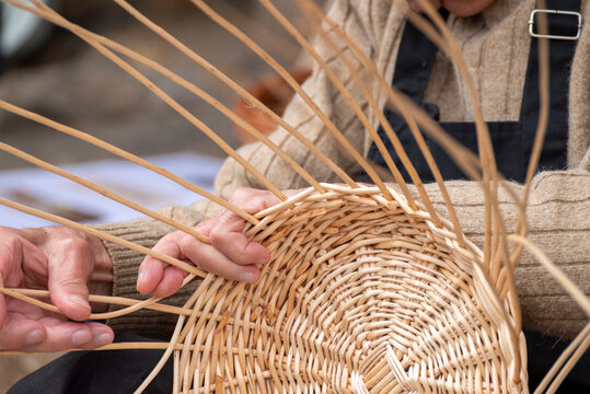 Artisan hands weaving wicker basket The Concept of traditional basketry and heritage
