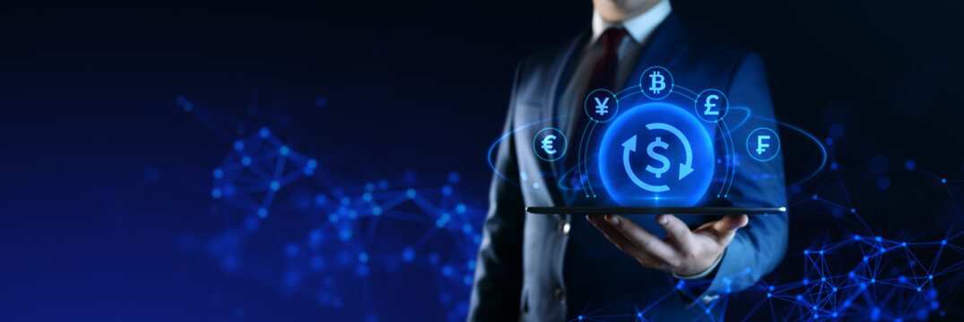 Businessman holding tablet with Currency Exchange icons on screen. Business and Finance concept