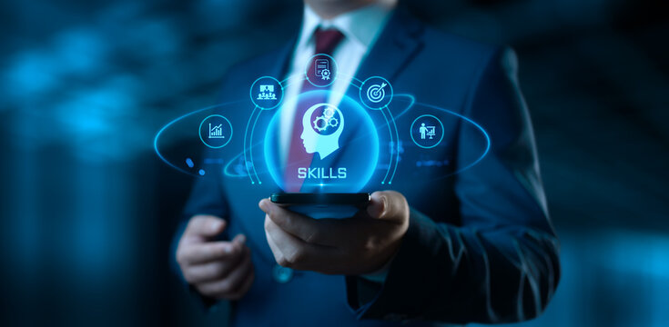 Businessman holding smartphone with Skills icons on screen - Education and E-Learning Concept