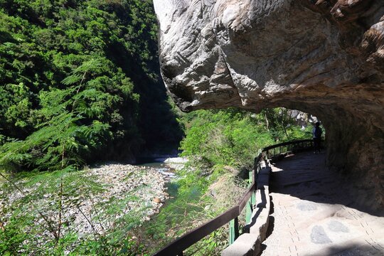 Taroko National Park in Taiwan. Shakadang hiking trail path cut out in rock cliff. Outdoors of Taiwan.