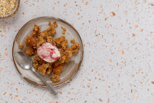 Single serving of apple oat crumble with ice cream