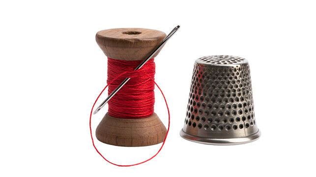 Wooden spool of red thread with needle and metal thimble