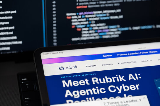 Rubrik Ai company web page on program code background