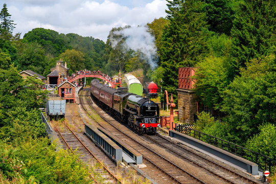A historic steam train at the Goathland station on its journey from Whitby to Pickering in the North York Moors National Park (England/UK)