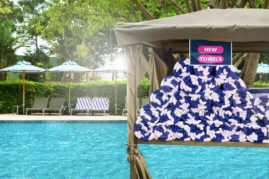 Stacked new, freshly towels at swimming pool.