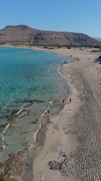 Experience the serene landscapes of Simos Beach, located on Elafonisos Island. Turquoise waters meet golden sands, inviting relaxation and exploration under the warm sun.
