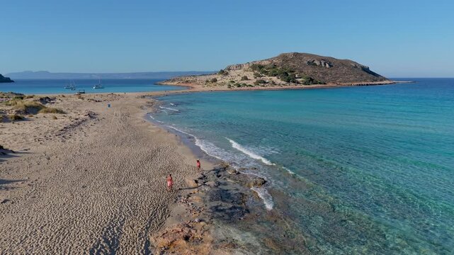 Explore the breathtaking shores of Simos Beach in Elafonisos, Greece, where golden sands meet turquoise waves. Perfect for relaxation, sunbathing, and enjoying natures wonders.