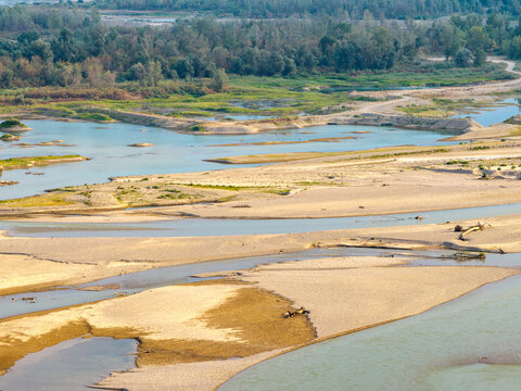 Aerial view of the Drina river featuring winding channels, exposed sandbars, and lush riverbanks in Crna Bara, Macva District, Serbia.