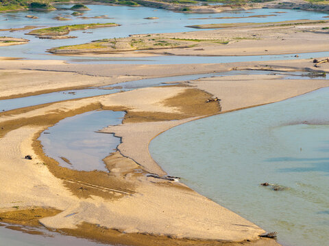 Aerial view of the Drina river with extensive sandbanks and shallow water channels in Crna Bara, Macva District, Serbia.