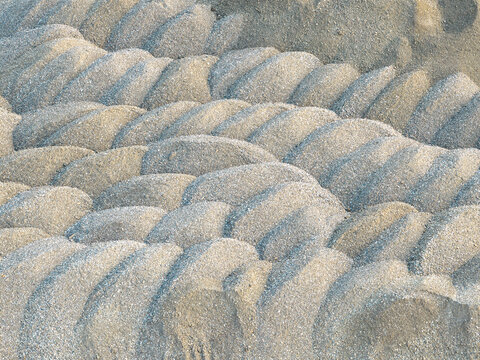 Aerial view of sand and gravel mounds deposited along the riverbank of the Drina river in Crna Bara, Macva District, Serbia.