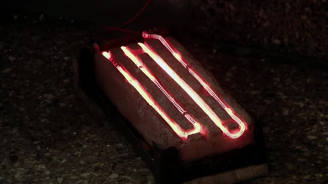 Close Up Of Homemade Electric Heater Element Glowing Red Hot In Jail - 4K