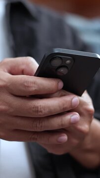 man holds smart phone in her hands and scrolls through the news feed. Close up of hand uses mobile. point finger on screen, texting text message.