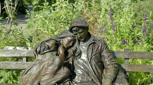 Bronze Sculpture of Couple Resting on Garden Bench